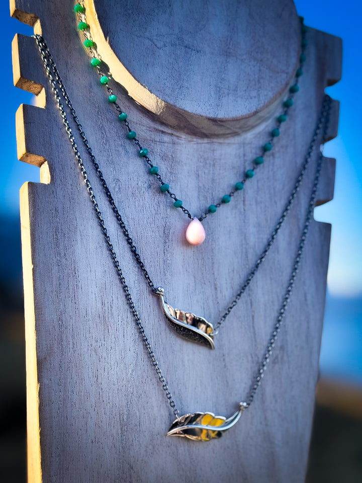 Two Berry Leaf necklaces and one Dew Drop Luminary