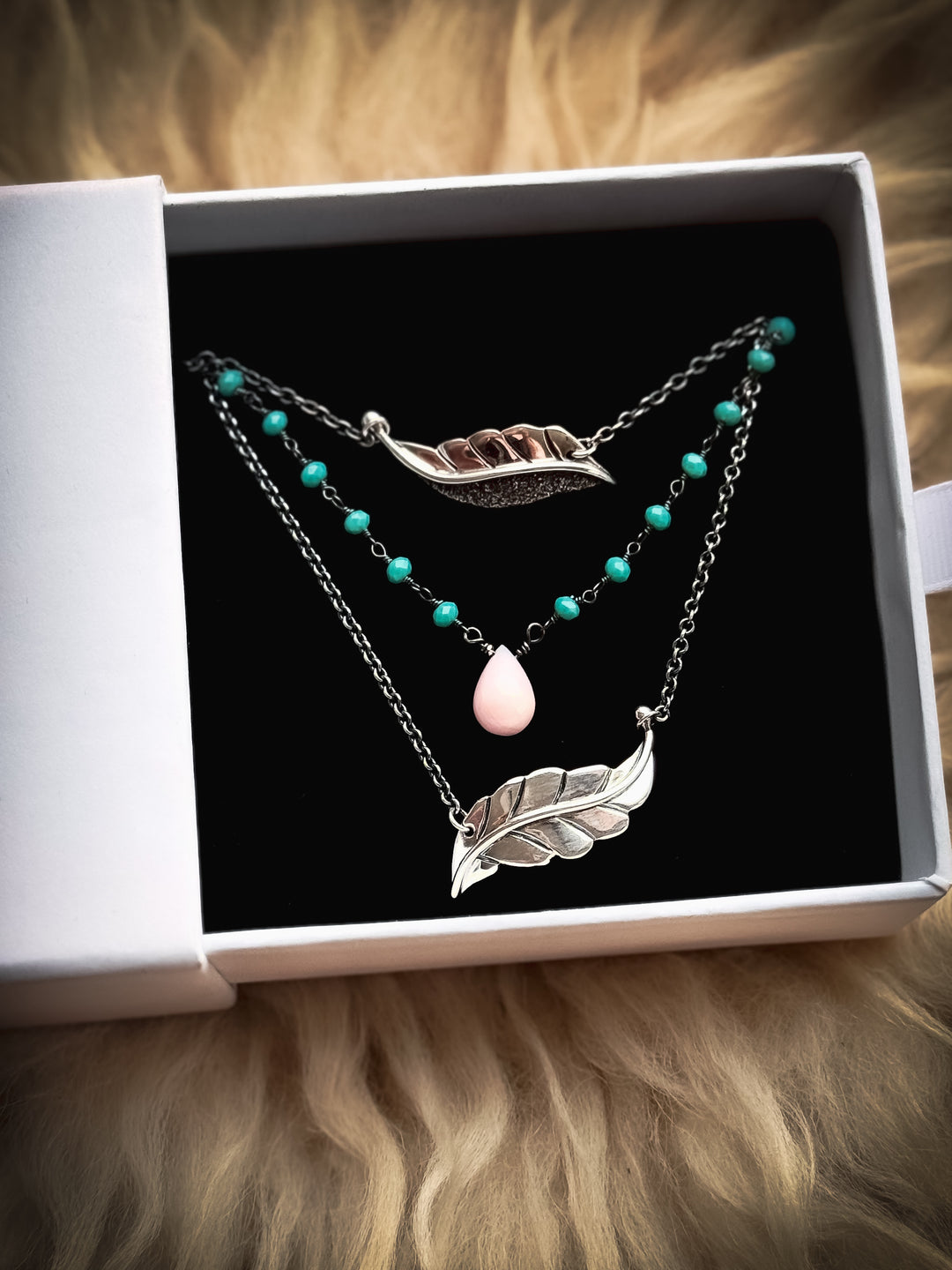 Two Berry Leaf necklaces and one Dew Drop Luminary