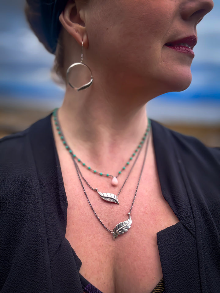 Two Berry Leaf necklaces and one Dew Drop Luminary
