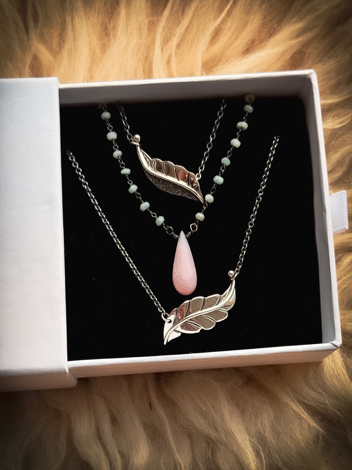 Two Berry Leaf necklaces and one Dew Drop Luminary