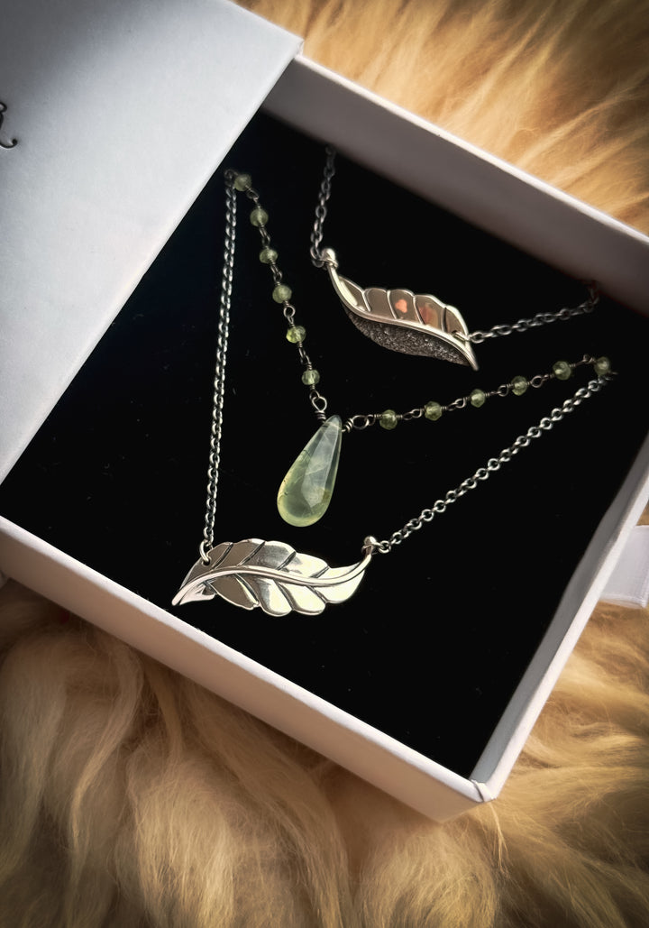 Two Berry Leaf necklaces and one Dew Drop Luminary