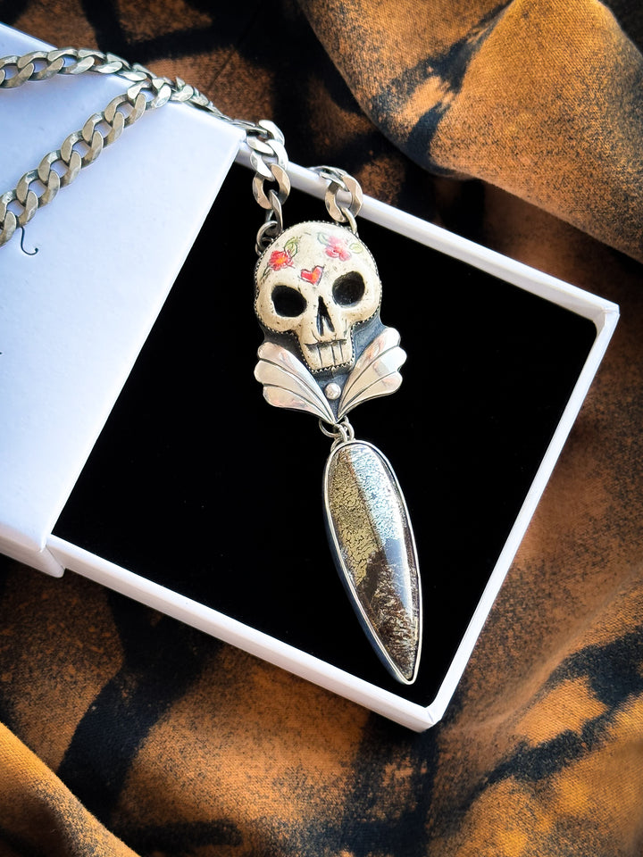 Dinosaur Bone in Pyrite Skull Necklace